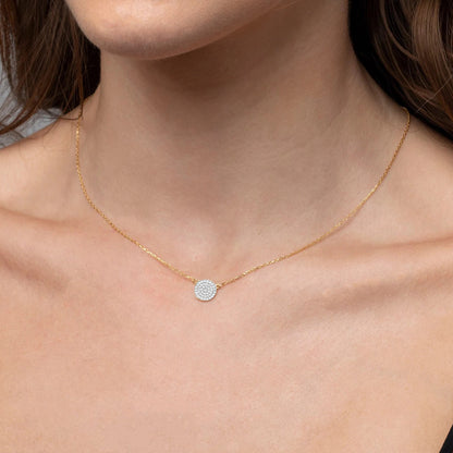 Signature Petite Moon pavé diamond pendant in 14K gold on a gold chain with diamonds